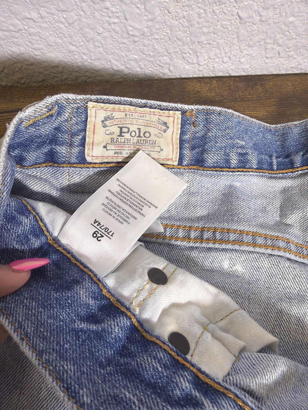 Light wash distressed star patch denim cutoff shorts for women by Polo Ralph Lauren, size 29, featuring frayed hems and patch details.