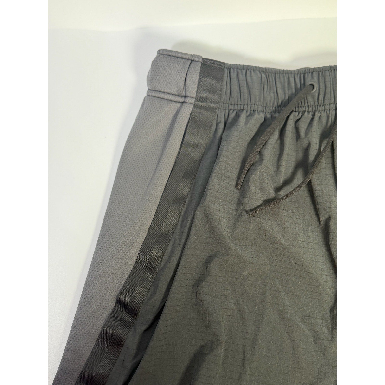 Black Nike Crossover Women’s Dri-FIT 5-inch basketball shorts with Nike logo, size M, displayed flat with waistband and side seams.