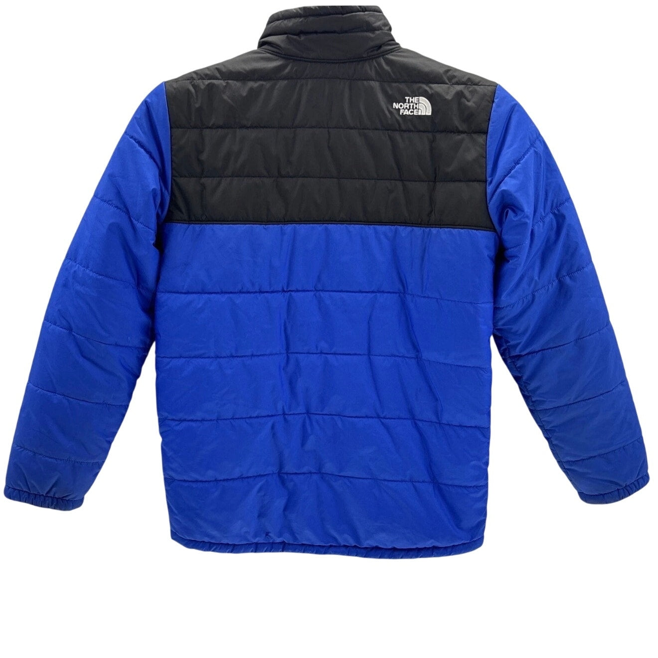 The North Face boys reversible Mount Chimborazo puffer jacket in blue and black, fleece-lined, size large, displayed on a hanger.
