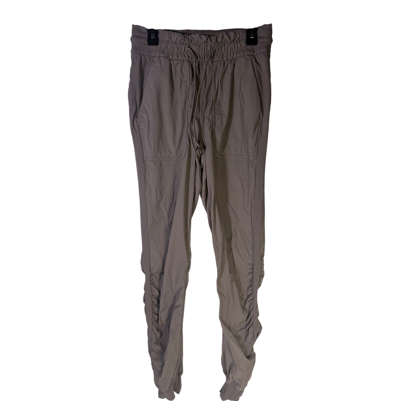 Lululemon women’s high-rise taupe gray ruched tapered pants, size 4, preowned, with a comfortable fit and stylish design.
