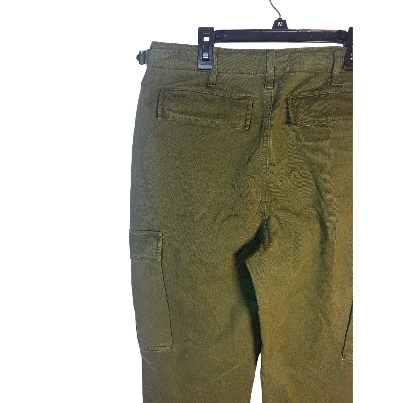 Olive green Good American fatigue cargo pants size 8, new with tags, featuring multiple pockets and a relaxed fit.