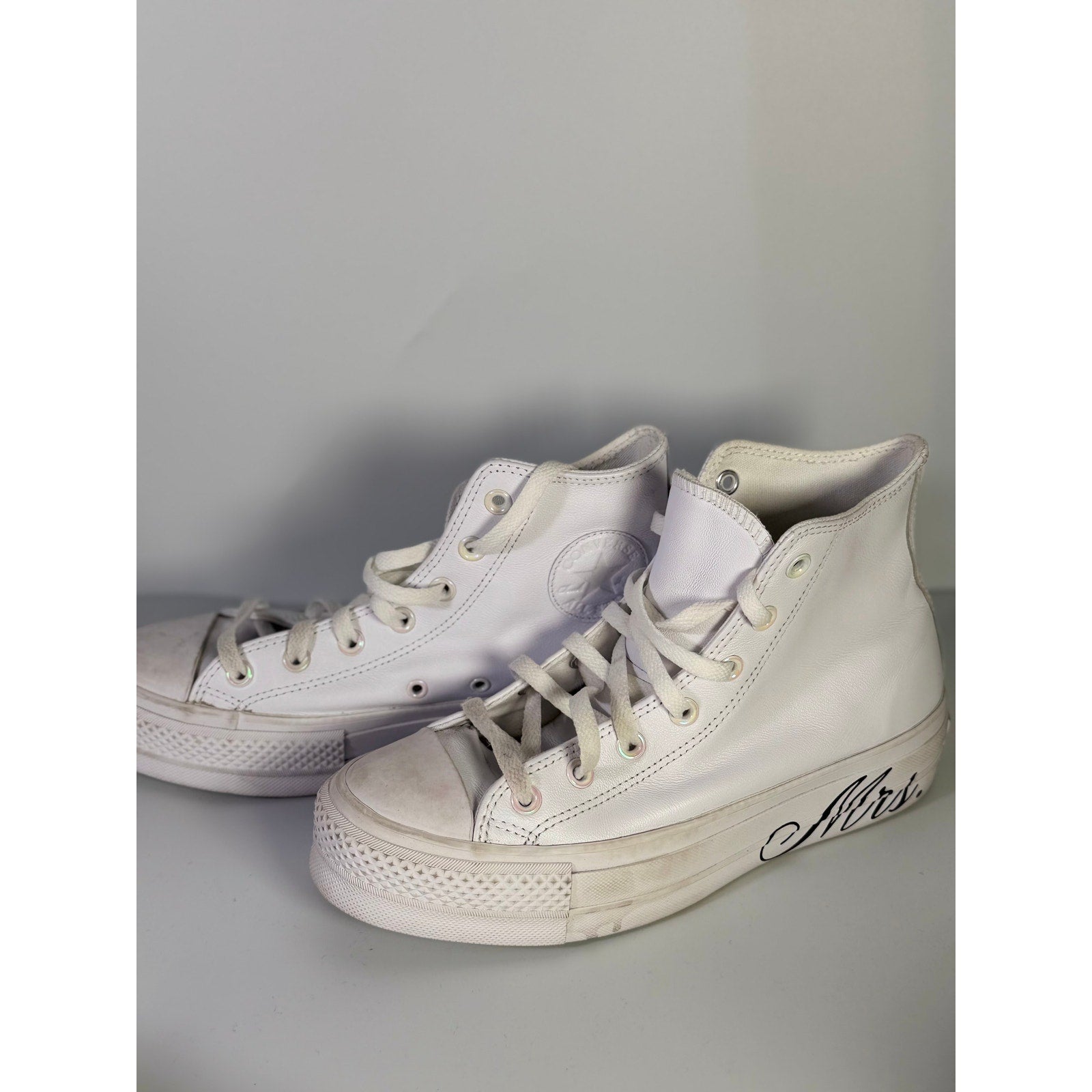 White Converse Chuck Taylor All Star Lift Hi leather sneakers for women, US size 8.5 with platform sole.