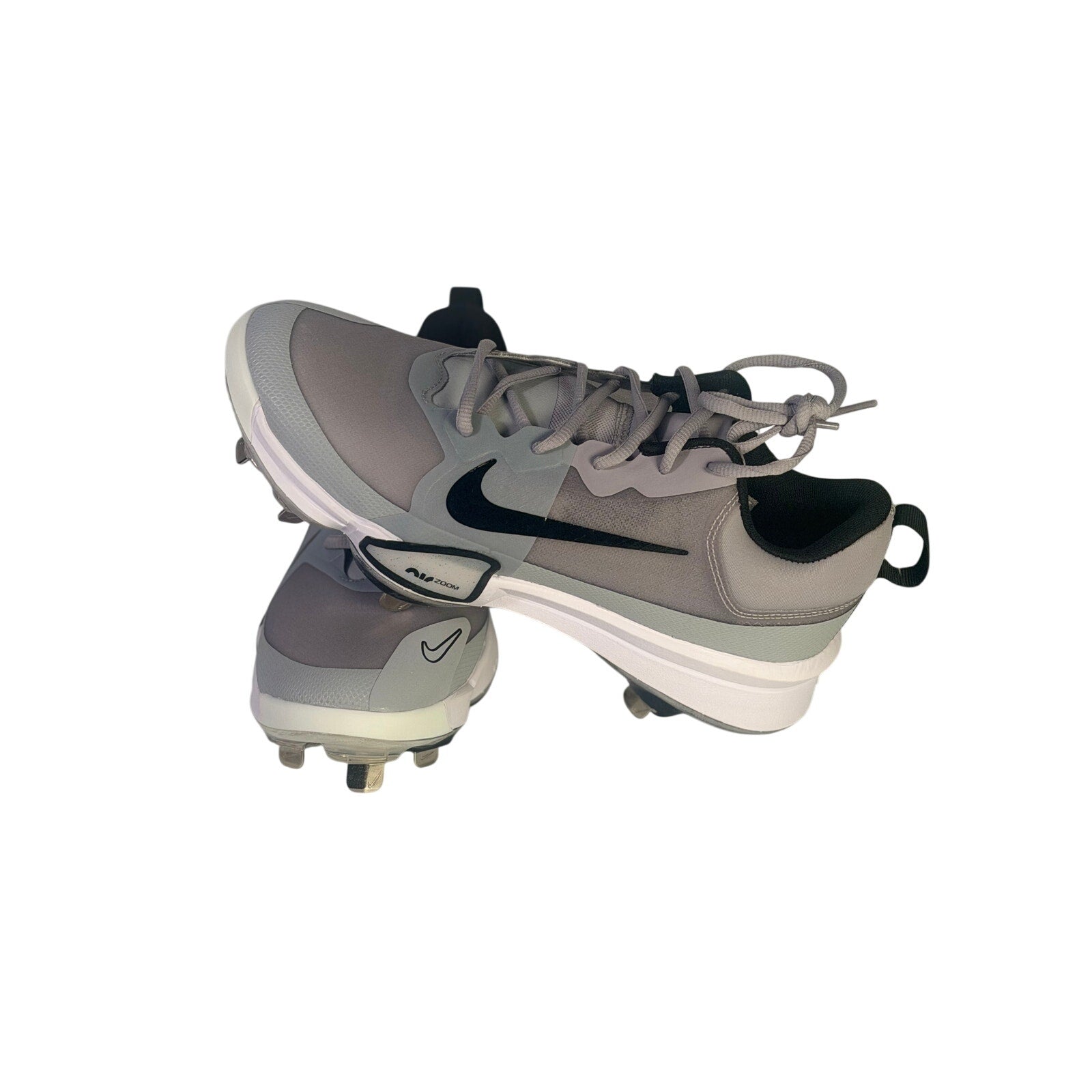 Nike Force Zoom Trout 9 Pro men's baseball cleats in grey, athletic shoes with Nike branding and cleat studs on the outsole.