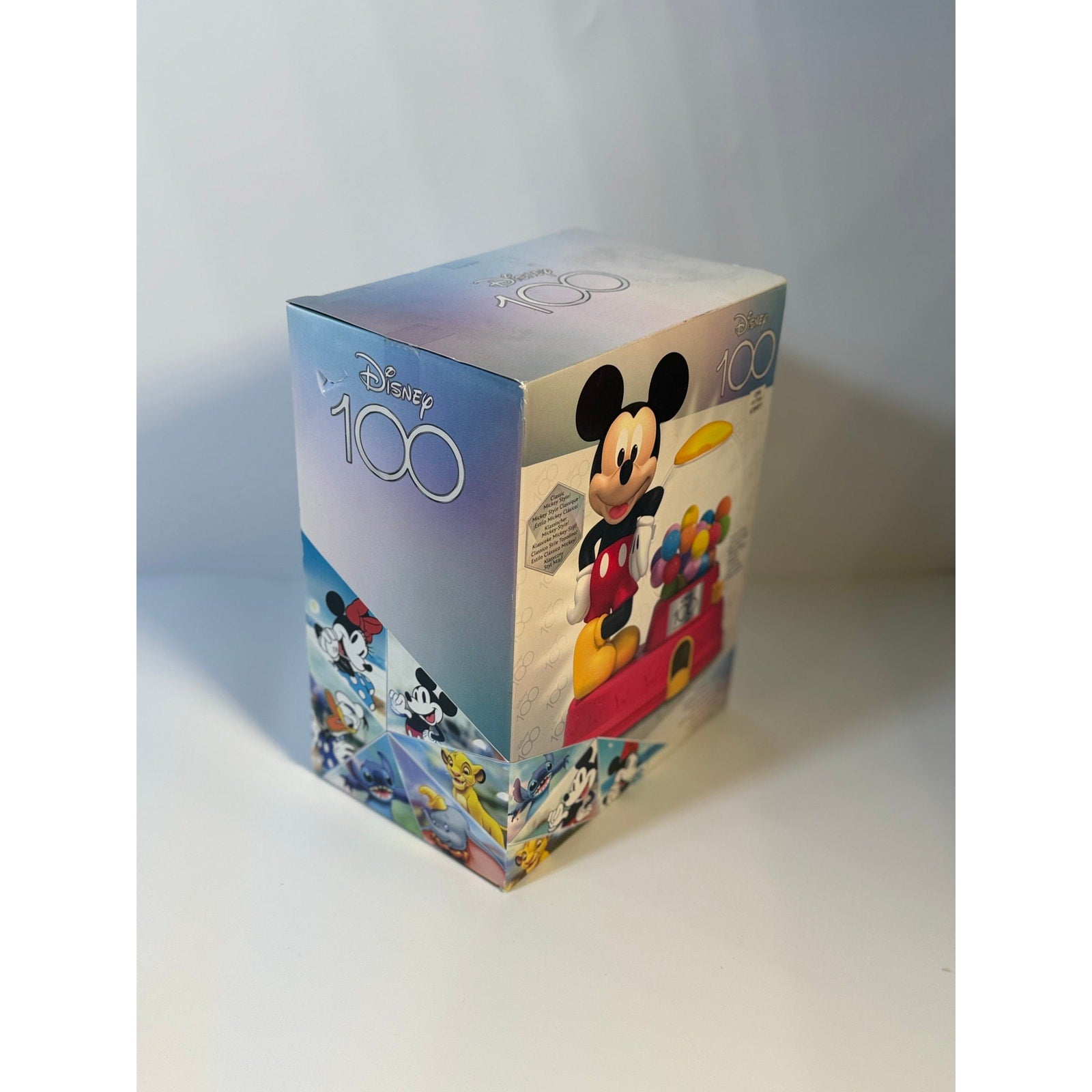 Disney 100 Mickey Mouse bubble gum machine candy dispenser toy by Disney, featuring Mickey Mouse figure with colorful design.