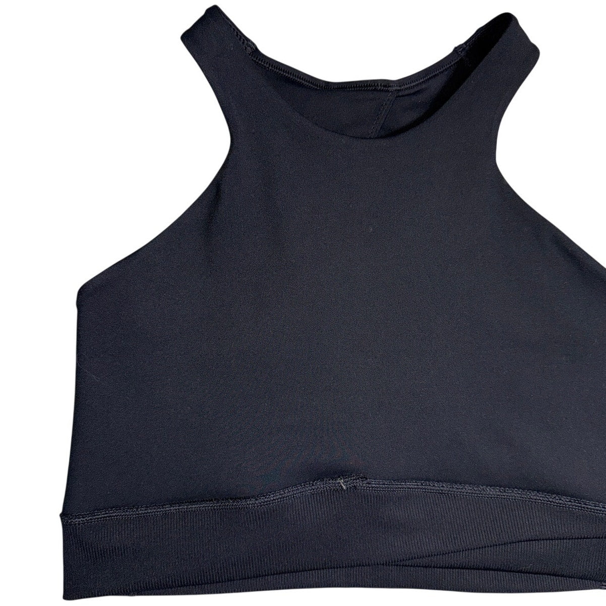 Nike women’s black high-neck racerback sports bra with tags, size large, shown on a flat lay with fabric details.