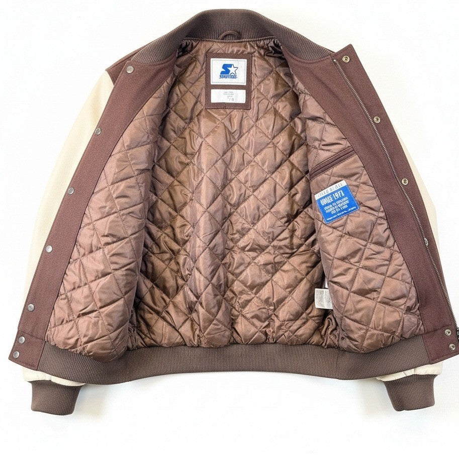 NFL Cleveland Browns men's varsity jacket with quilted lining, size large, featuring team logo and detailed stitching.