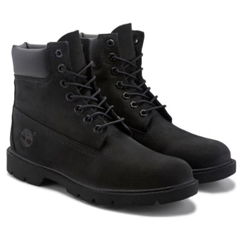 Men's Timberland 6-inch waterproof boots with padded collar in size 9.5 M, showcasing durable leather and rugged hiking style.