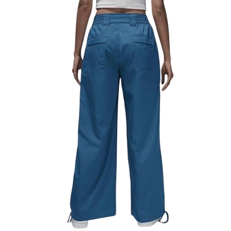 Women's Jordan Chicago Cargo Pants in blue, medium size, featuring multiple pockets and relaxed fit, displayed on a hanger.