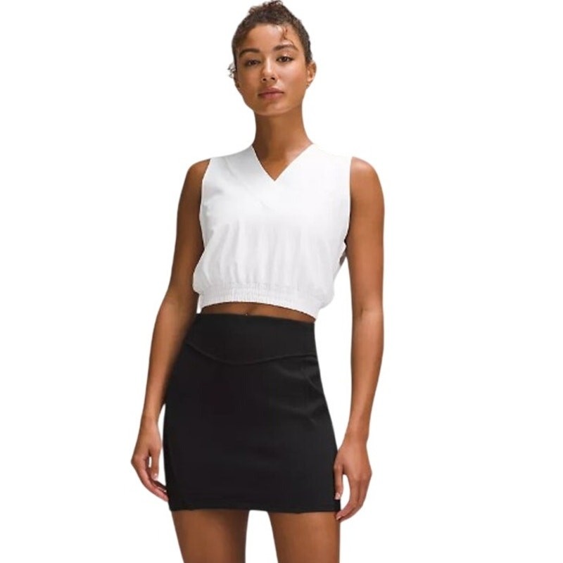 Black Lululemon Scuba High-Rise Mini Skirt for women, size medium, showing the fitted style and soft fabric texture.
