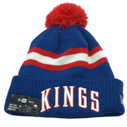 Youth blue and red New Era NBA Sacramento Kings pom beanie hat with team logo, knit design, warm and stylish for fans.