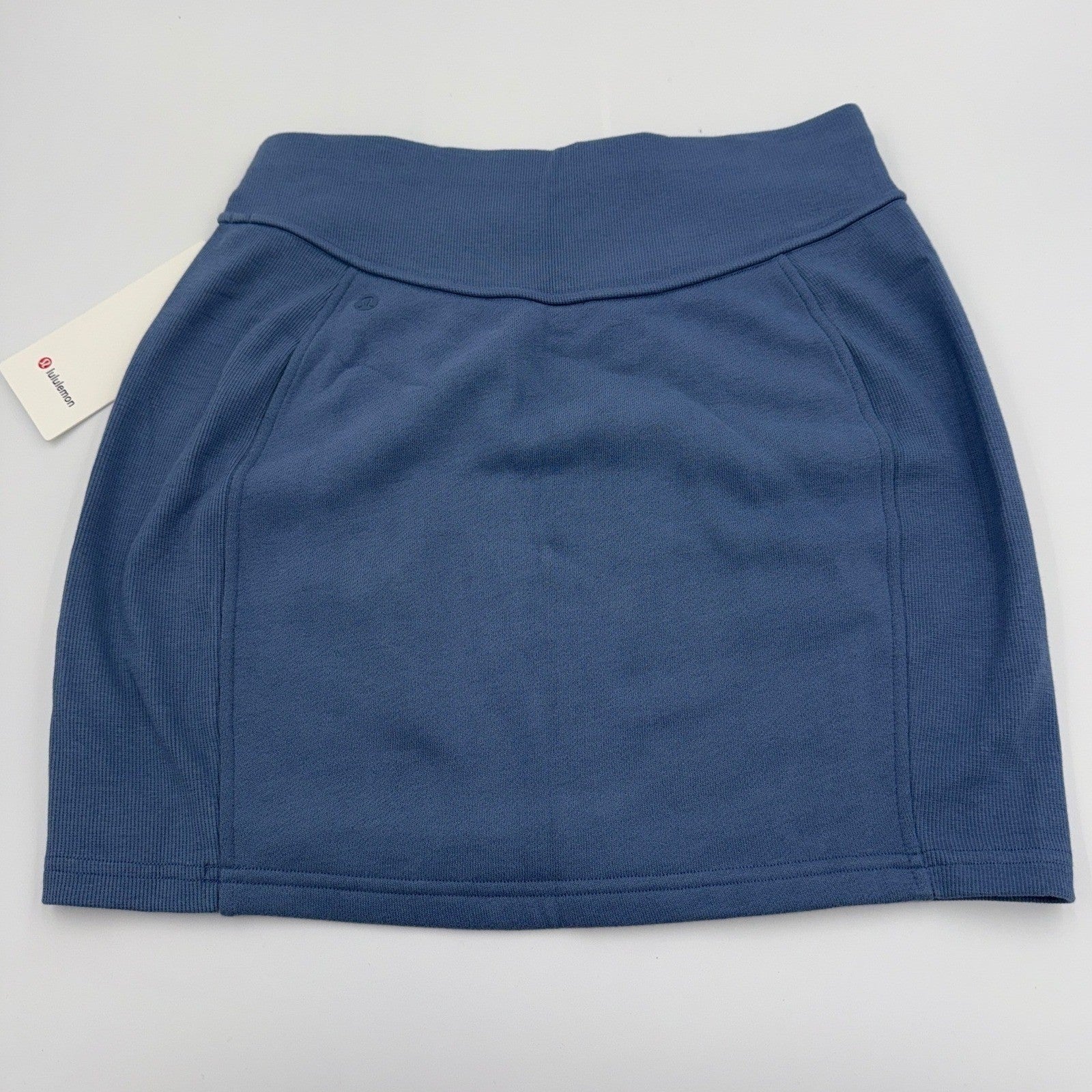 Lululemon NWT scuba high-rise stretch mini skirt in small, women's athleisure skirt with a sleek, fitted design and smooth fabric.