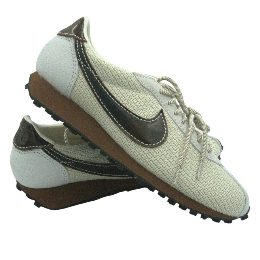 Men's Nike Challenger OG retro sneakers in chocolate brown, showing the side view with textured leather and Nike branding.