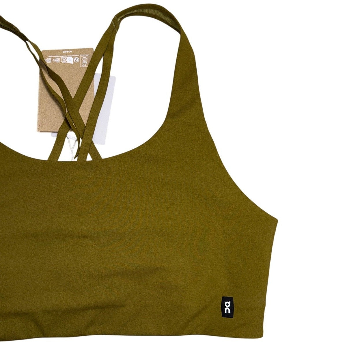 On Running Movement Performance Sports Bra in hunter green, women's XL size, with supportive design and Oncloud branding visible.
