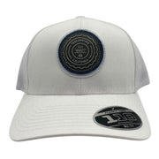 TravisMathew FlexFit Tech hat with "The Patch" style, featuring a structured design and adjustable fit in neutral color.