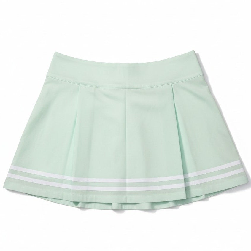 Women's CALIA Truelight golf skirt in mint Ceylon green, 15-inch pleated design, size 4, shown on a model.