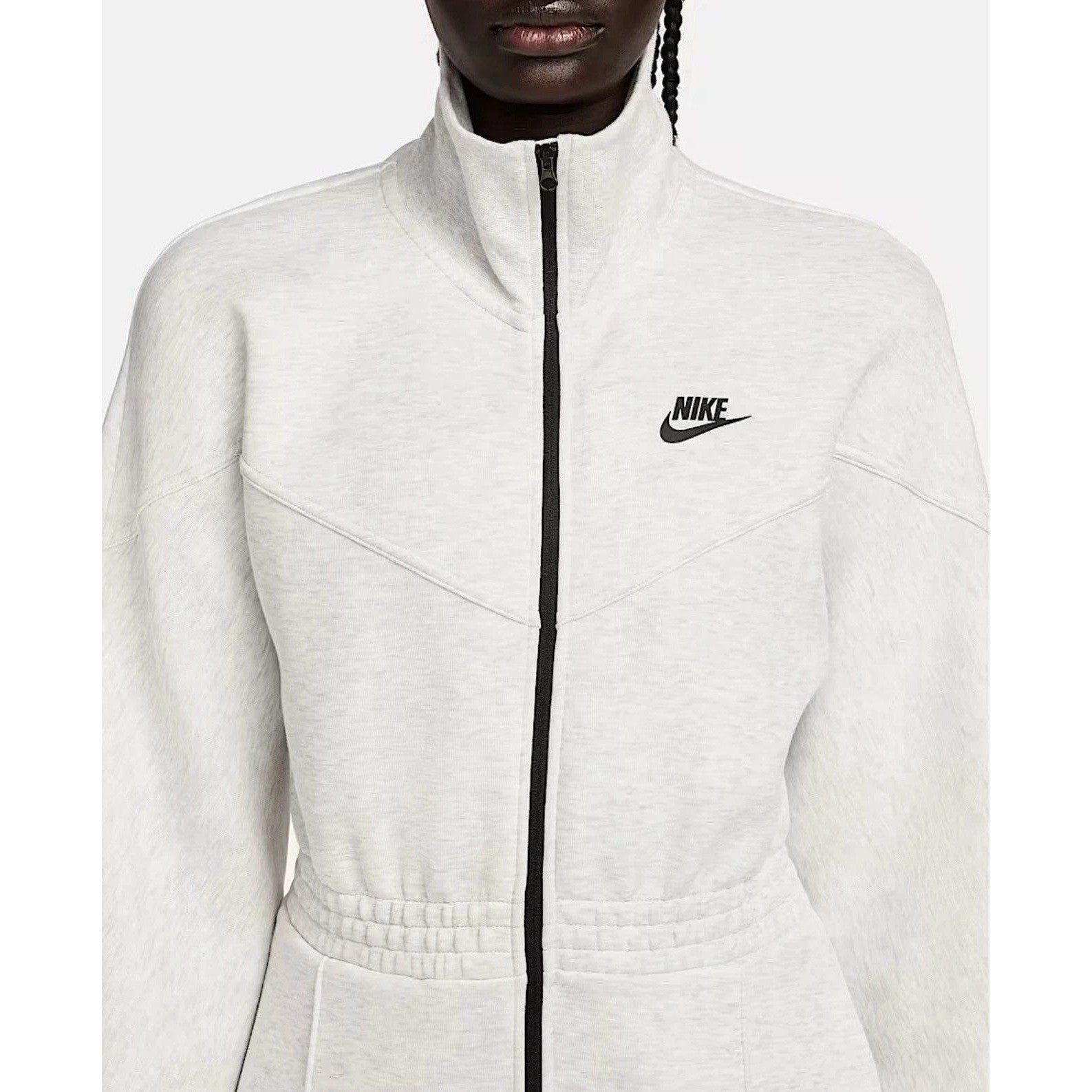 Nike Tech Fleece Windrunner jumpsuit in grey, featuring a fitted design with Nike branding and a full-length front zipper.
