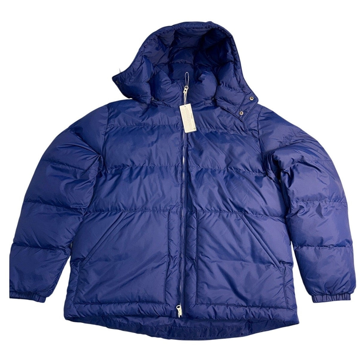 Alpine Design men's 1962 insulated puffer jacket in space blue, showing the front view with padded insulation and zipper closure.