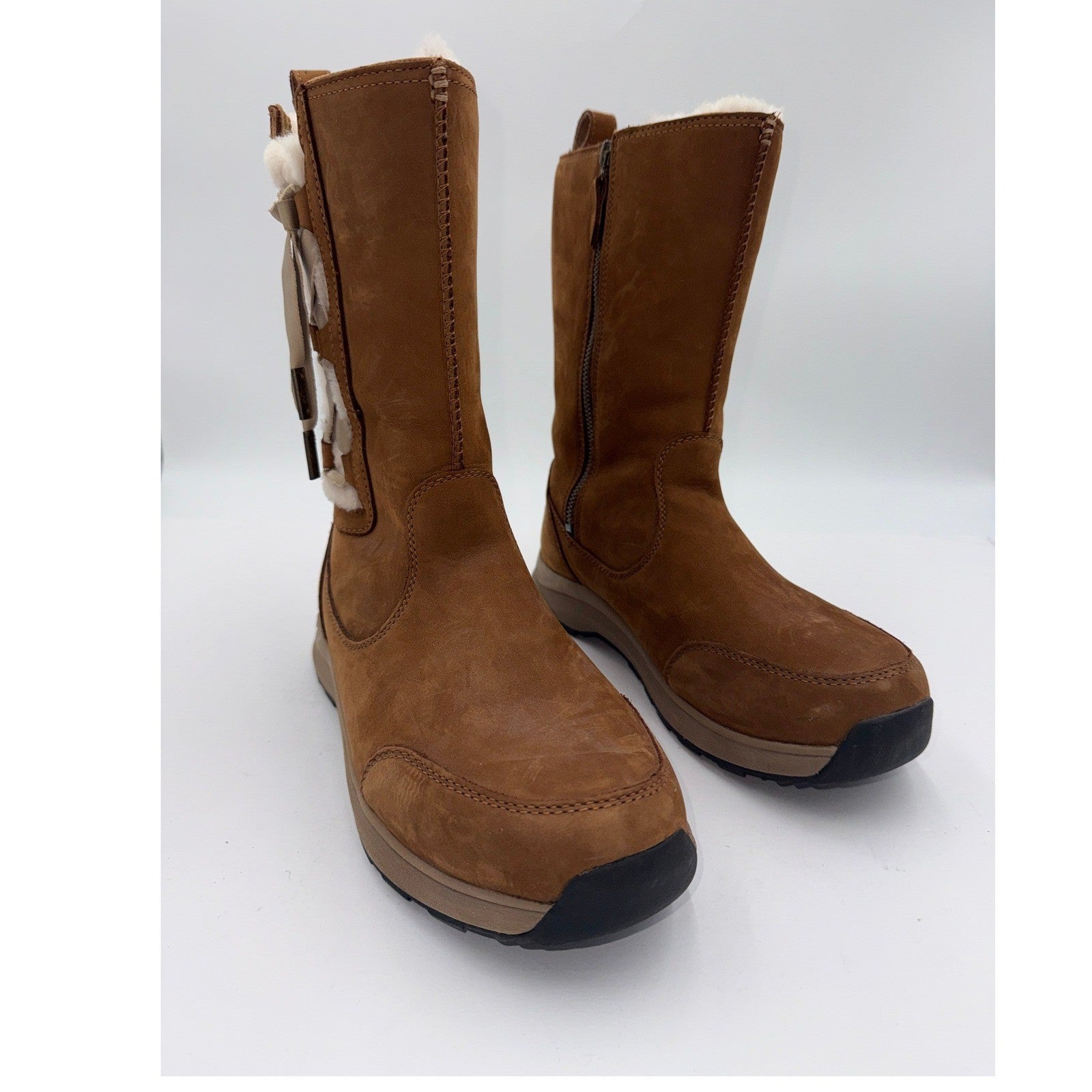 UGG Women's waterproof leather winter boots in chestnut color, size 9.5W, featuring a stylish and durable design.