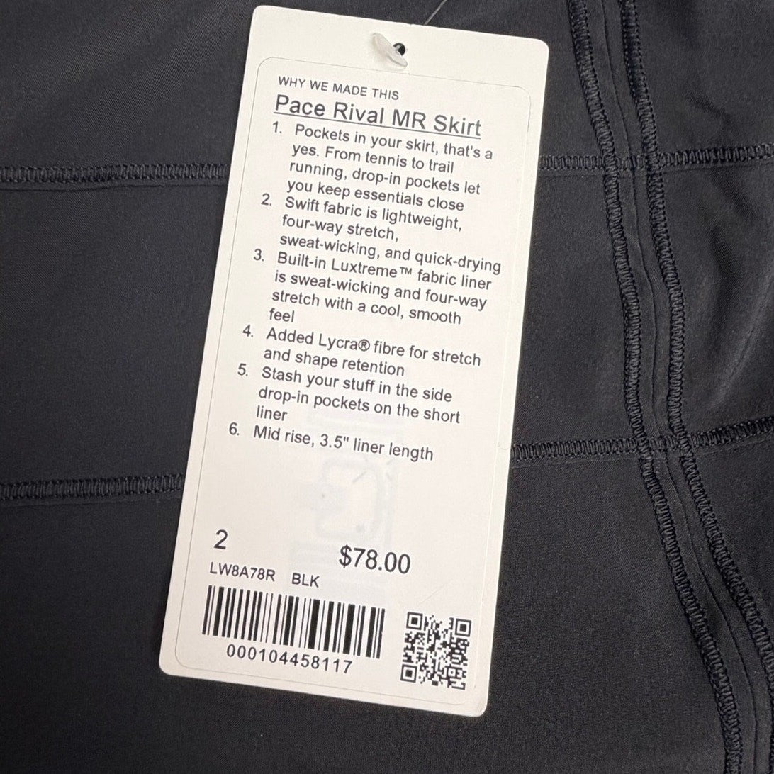 Black Lululemon Pace Rival mid-rise skirt in size 2, shown laid flat with waistband and athletic silhouette.