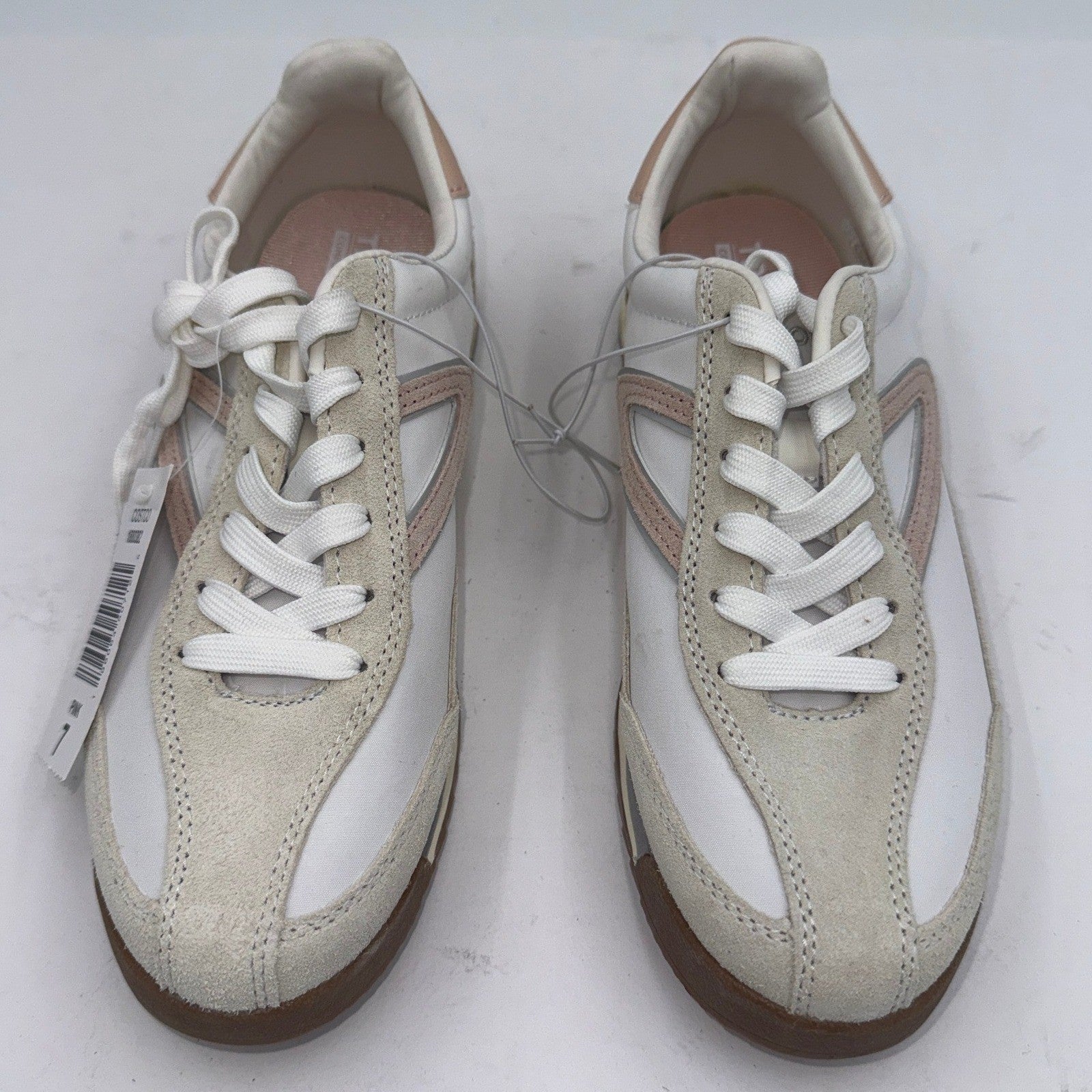 Pink Tretorn women's sneakers with white soles, 7-inch size, featuring a casual and sporty design.