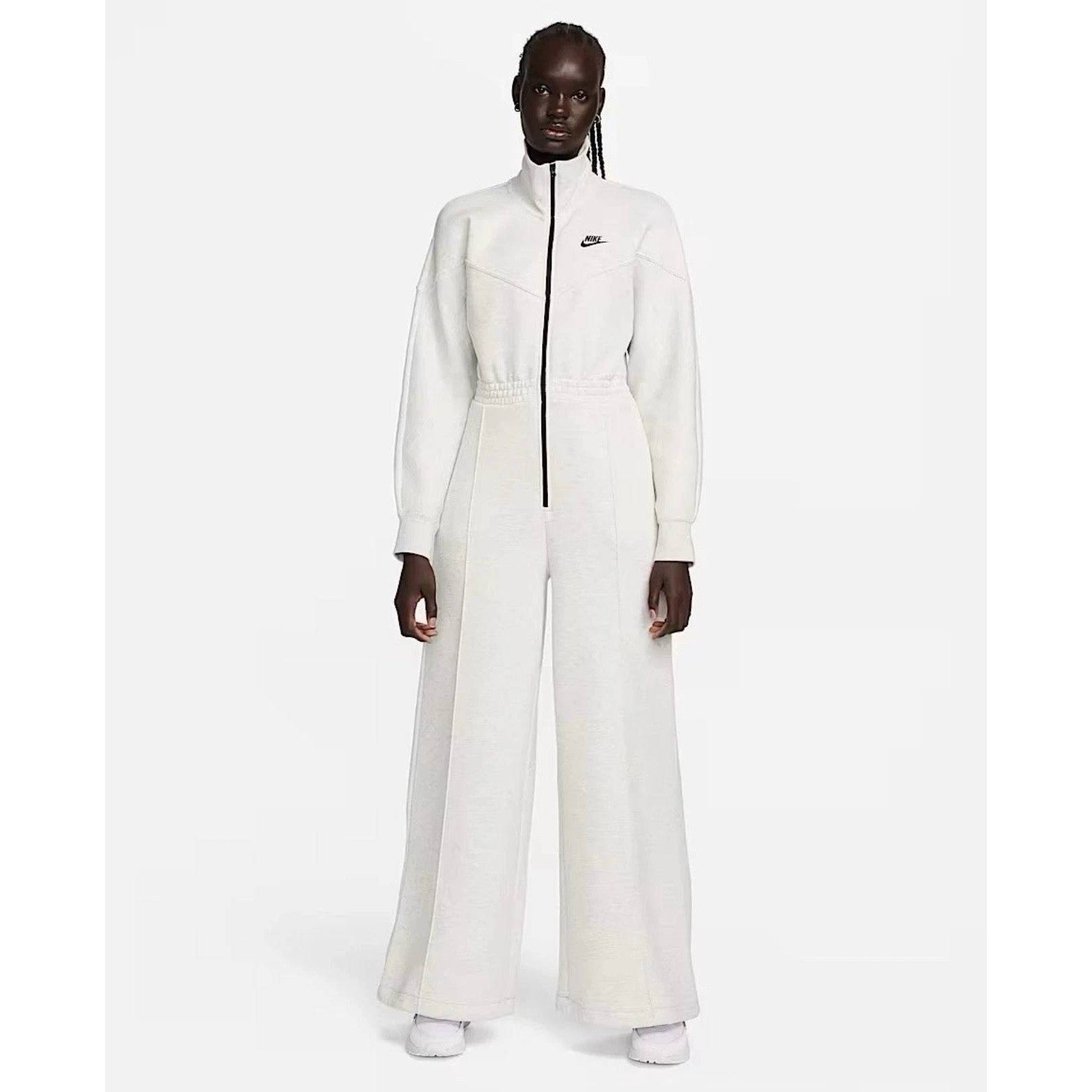 Nike Tech Fleece Windrunner jumpsuit in grey, featuring a sleek design with a hood and zip-up front for sporty comfort.