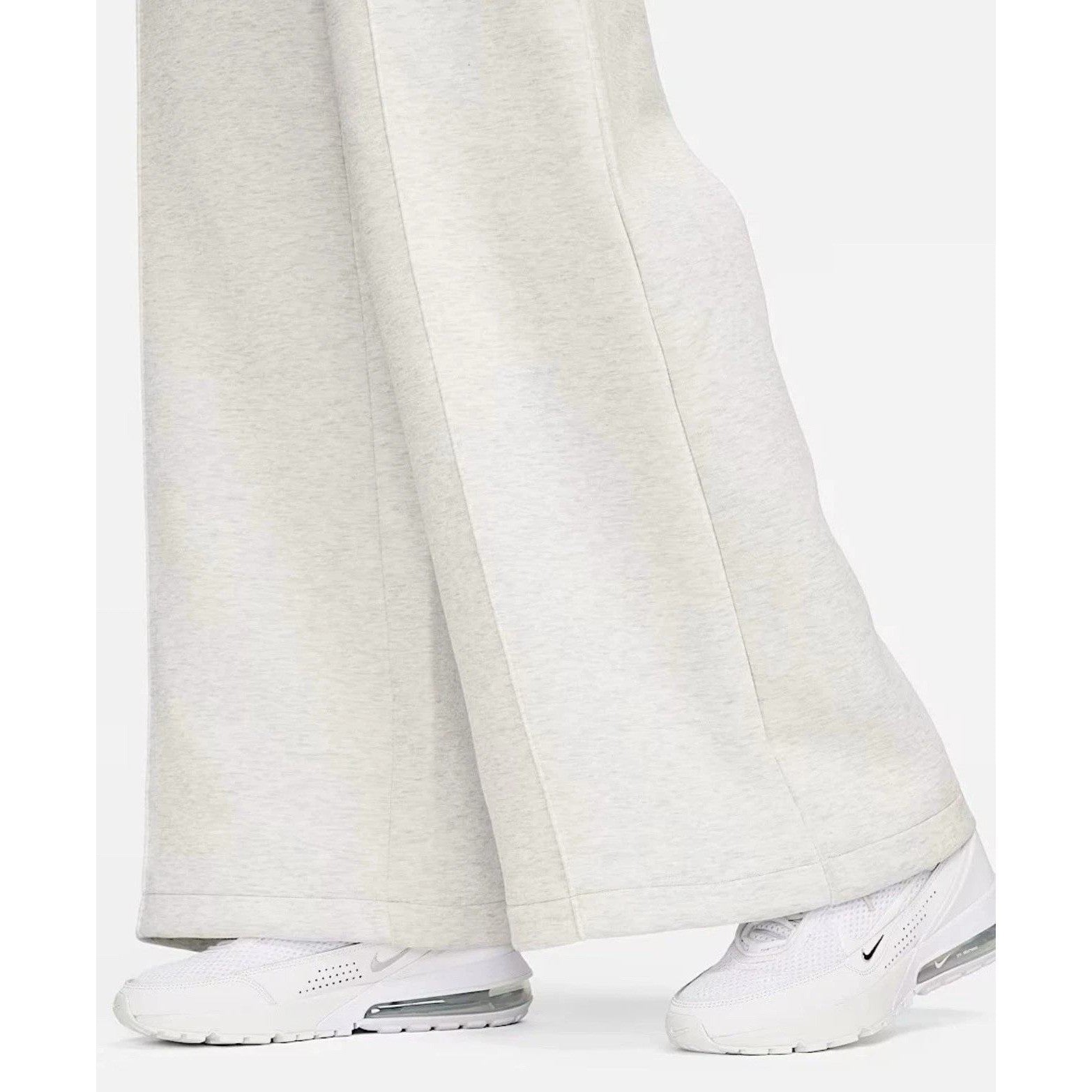 Nike Tech Fleece Windrunner jumpsuit in grey, featuring a fitted design, full-length sleeves, and Nike branding details.