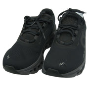 On Running Cloudmonster women's sneakers in black and magnet color, showing the stylish athletic design and cushioning details.