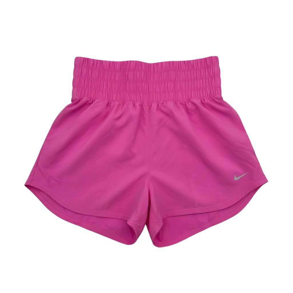 Pink Nike women's high-waisted training shorts with Dri-FIT fabric, designed for comfort and active wear.