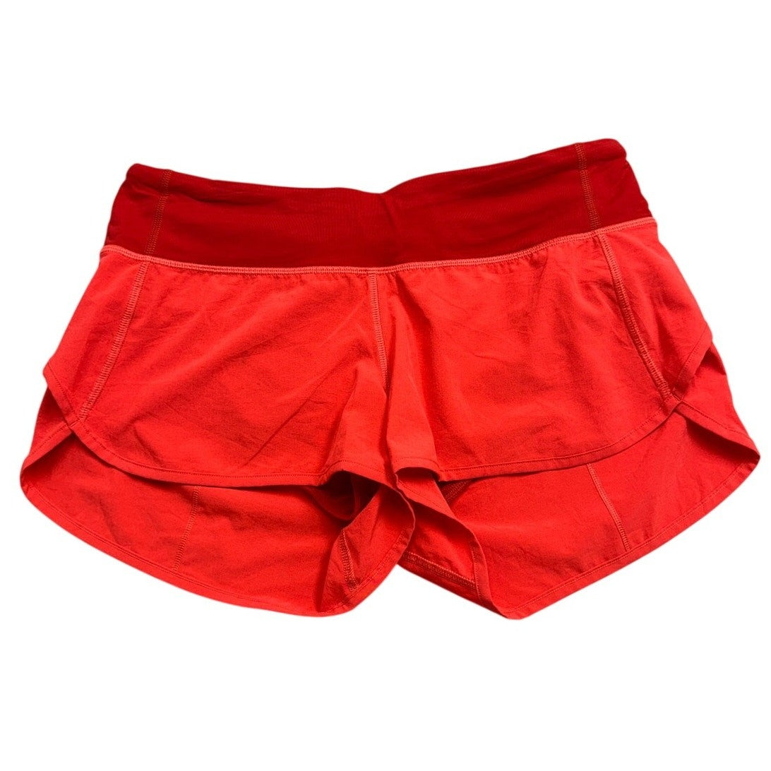 Lululemon Speed 2.5-inch vibrant coral women's running shorts, size 6, lightweight athletic shorts with a sleek fit.