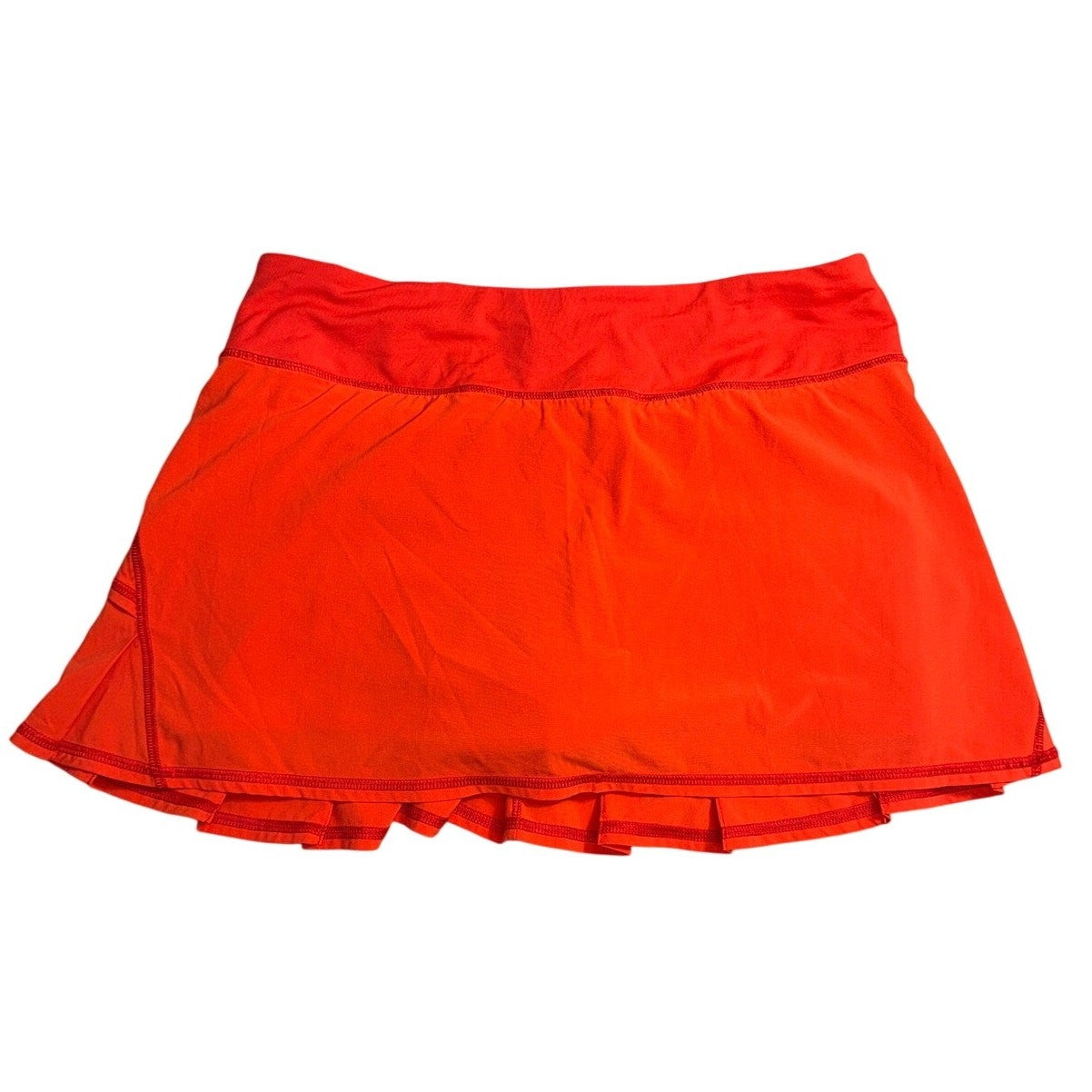 Lululemon Pace Rival style athletic skort in red, women's size 8, featuring a fitted waistband and sporty design.