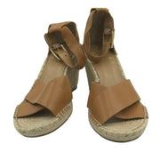 Vince Camuto women's tan espadrille wedge sandals size 8.5 with braided jute heel and ankle straps on a neutral background.