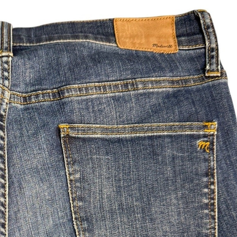 Madewell high riser skinny jeans for women, size 32, in great condition, shown hanging with a close-up of denim fabric.