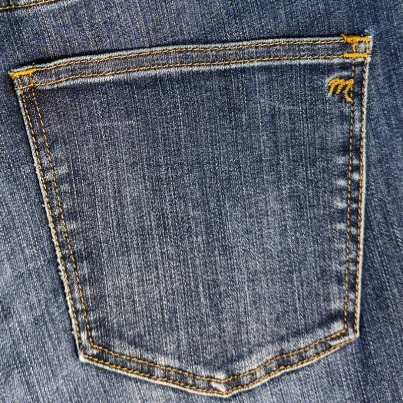Madewell high riser skinny jeans for women, size 32, in great condition, shown hanging with detailed denim texture and fit.