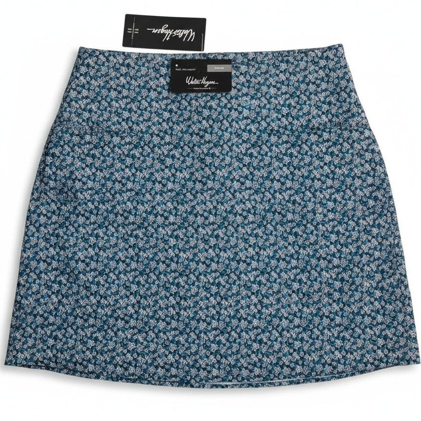 Walter Hagen P11 Sculpt Skort 17-inch in Dogwood Ditsy pattern worn by a woman, showcasing lightweight athletic women's skort.