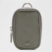 Lululemon olive clippable Nano Pouch keychain handbag with compact design and keyring attachment.