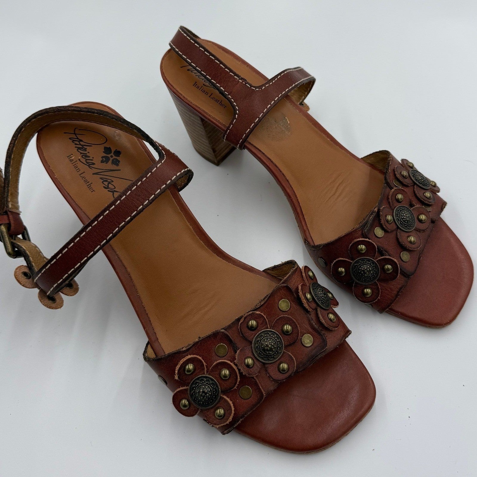Patricia Nash brown Italian leather floral studded women's sandals, size 9.5, featuring open toe design and decorative floral accents.