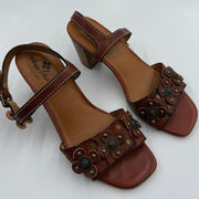 Patricia Nash brown Italian leather floral studded women's sandals, size 9.5, featuring open toe design and decorative floral accents.