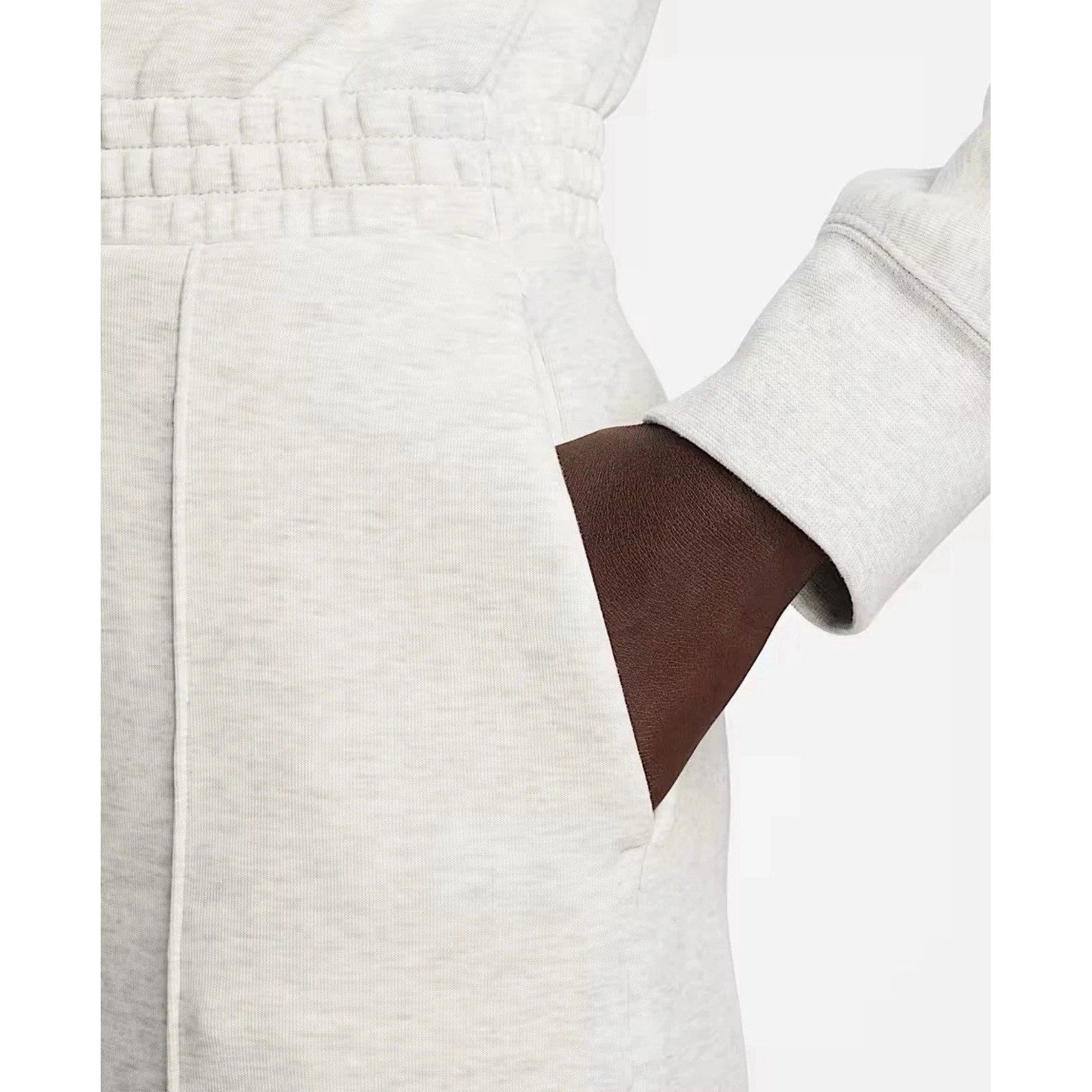 Nike Tech Fleece Windrunner jumpsuit in grey, featuring a full-length design with a hood and sporty style.