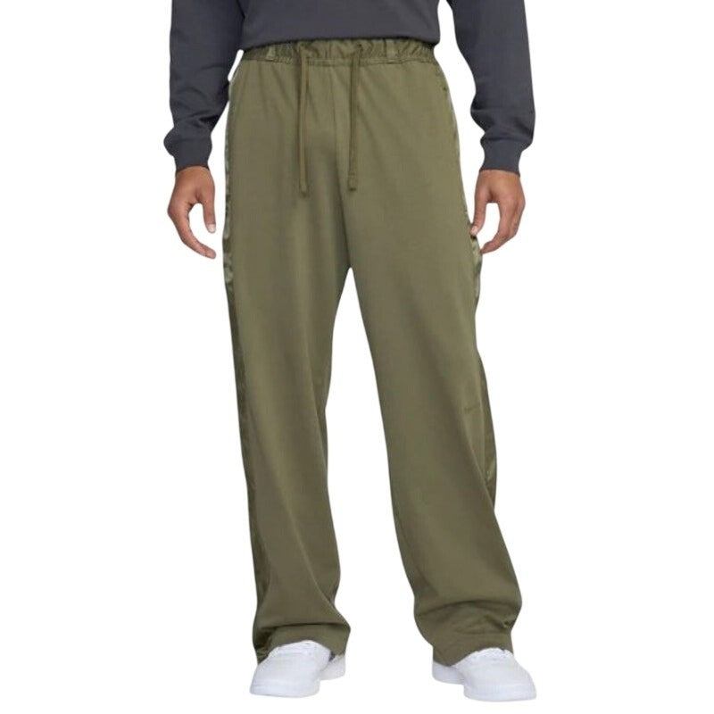 Nike men's XXL Devin Booker basketball pants in olive green, shown with side pockets and athletic fit.