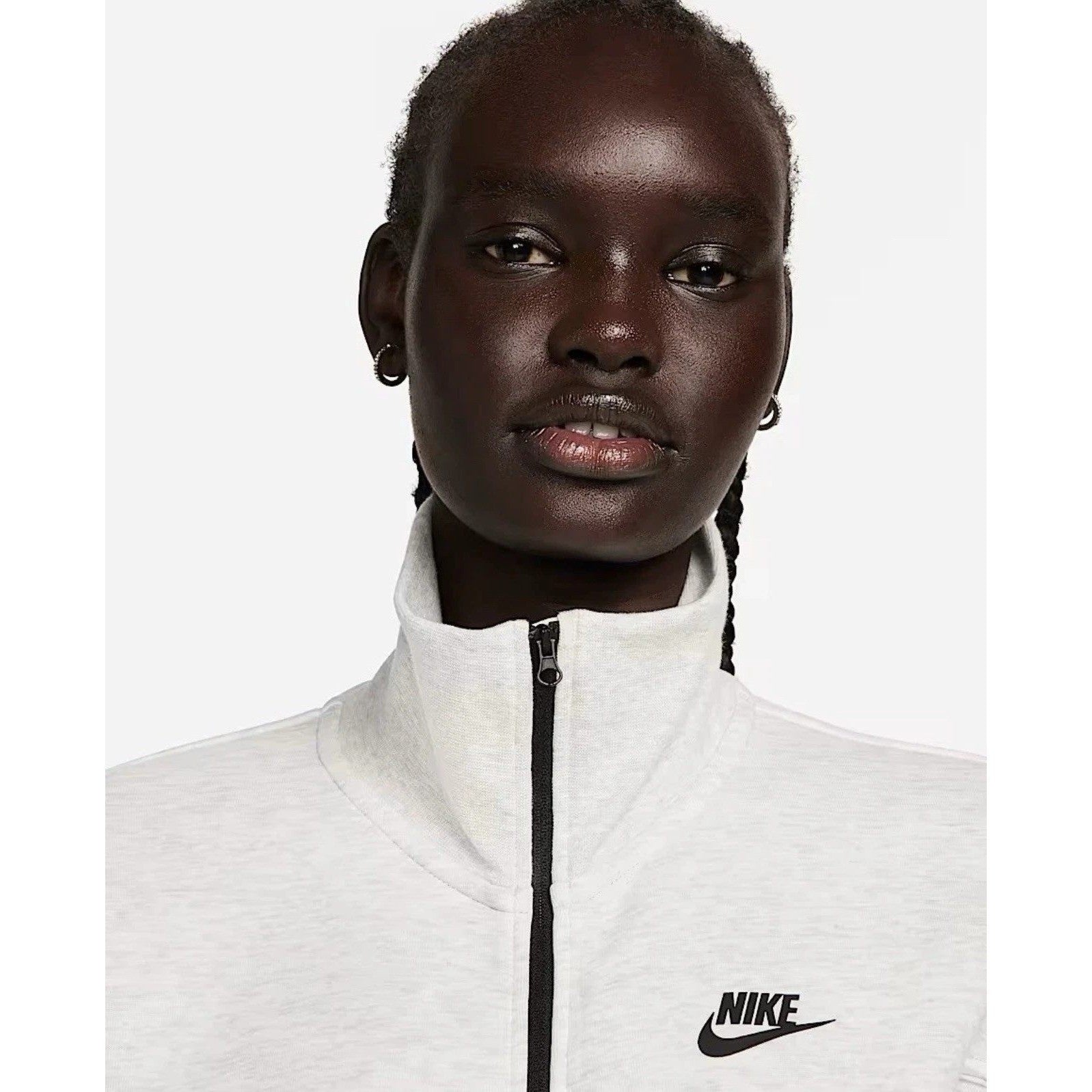Nike Tech Fleece Windrunner jumpsuit in grey, front view showing the Nike logo and full-length design.