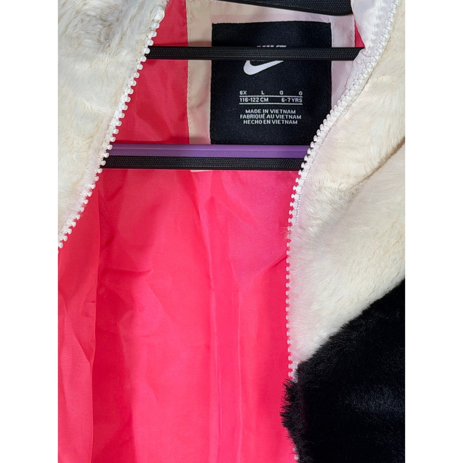 Nike girls' faux fur full zip jacket in cream and black, oversized style, size 6X, featuring Nike swoosh logo.