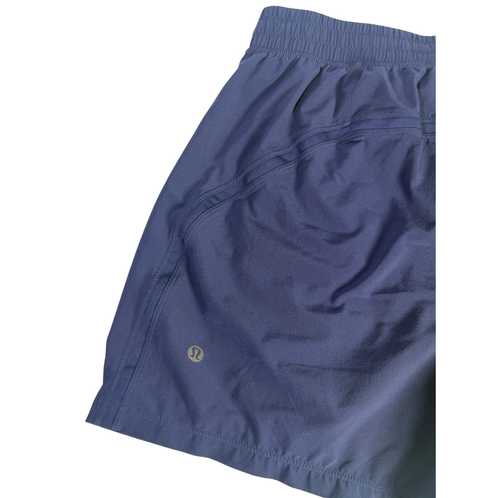 Lululemon men's navy blue athletic running shorts, size M, lightweight fabric, with drawstring waist and athletic design.