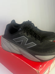 Black New Balance Fresh Foam X More v5 men's running shoes, size 11, athletic shoes with sleek design and supportive cushioning.