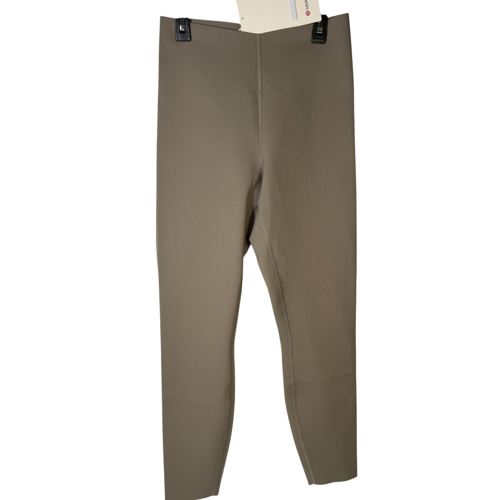 Lululemon Glow Up high-rise leggings in taupe gray, size 10, made of stretchy athletic fabric, shown laid flat.