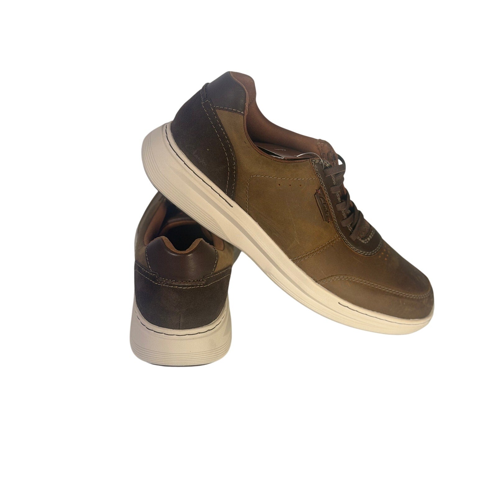 Clarks men's brown casual golf shoes with lace-up design, size 10M, new in box, shown in a close-up image.