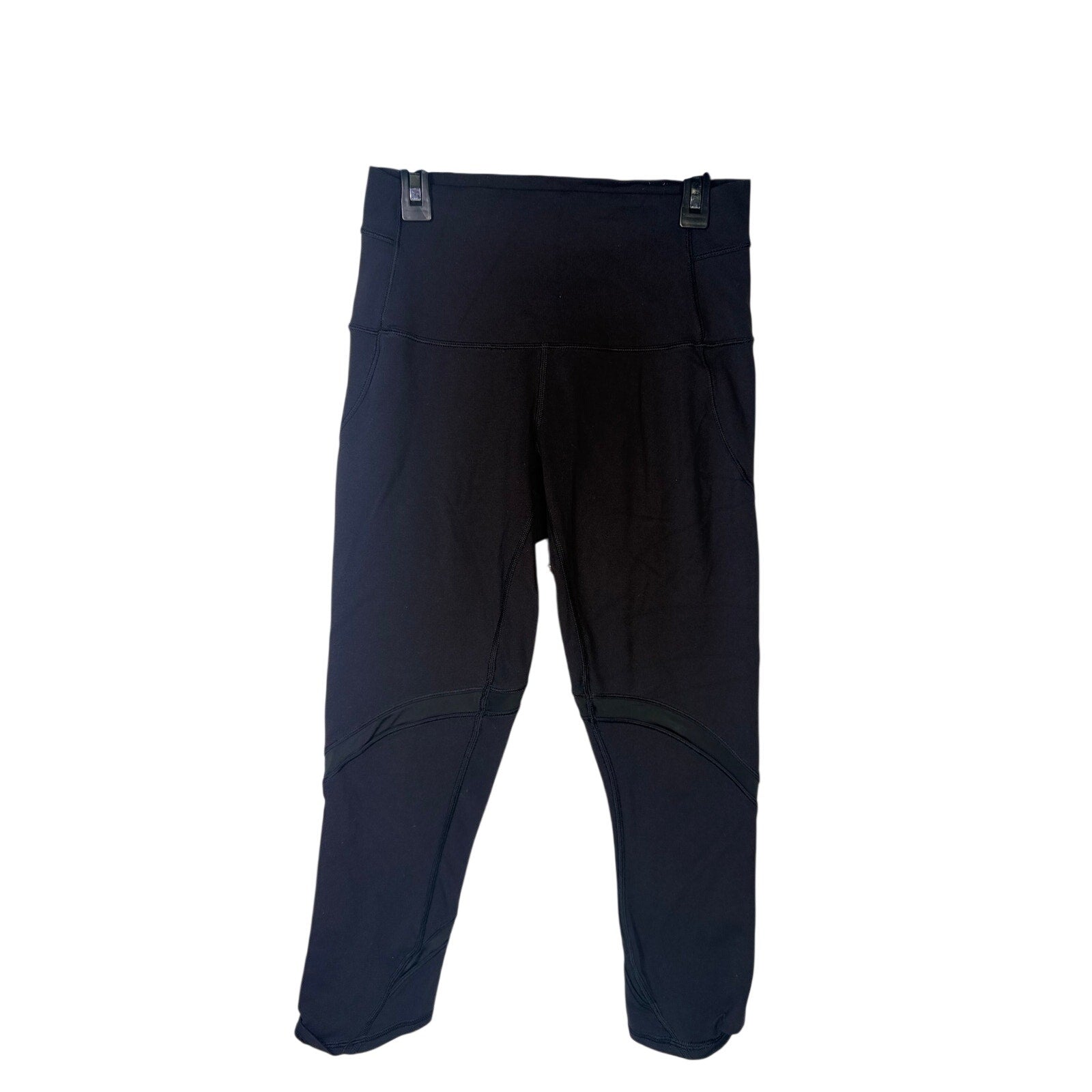 Black Lululemon women's high-rise paneled cropped leggings with a snug fit and seamless design, size 6.