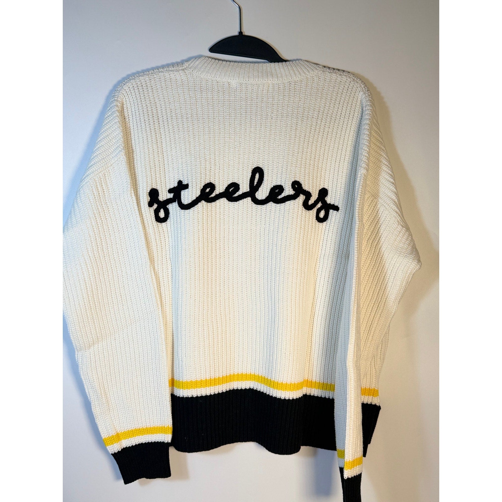 Women's Pittsburgh Steelers knit sweater by Wear by Erin Andrews, featuring team logo and cozy knit fabric.