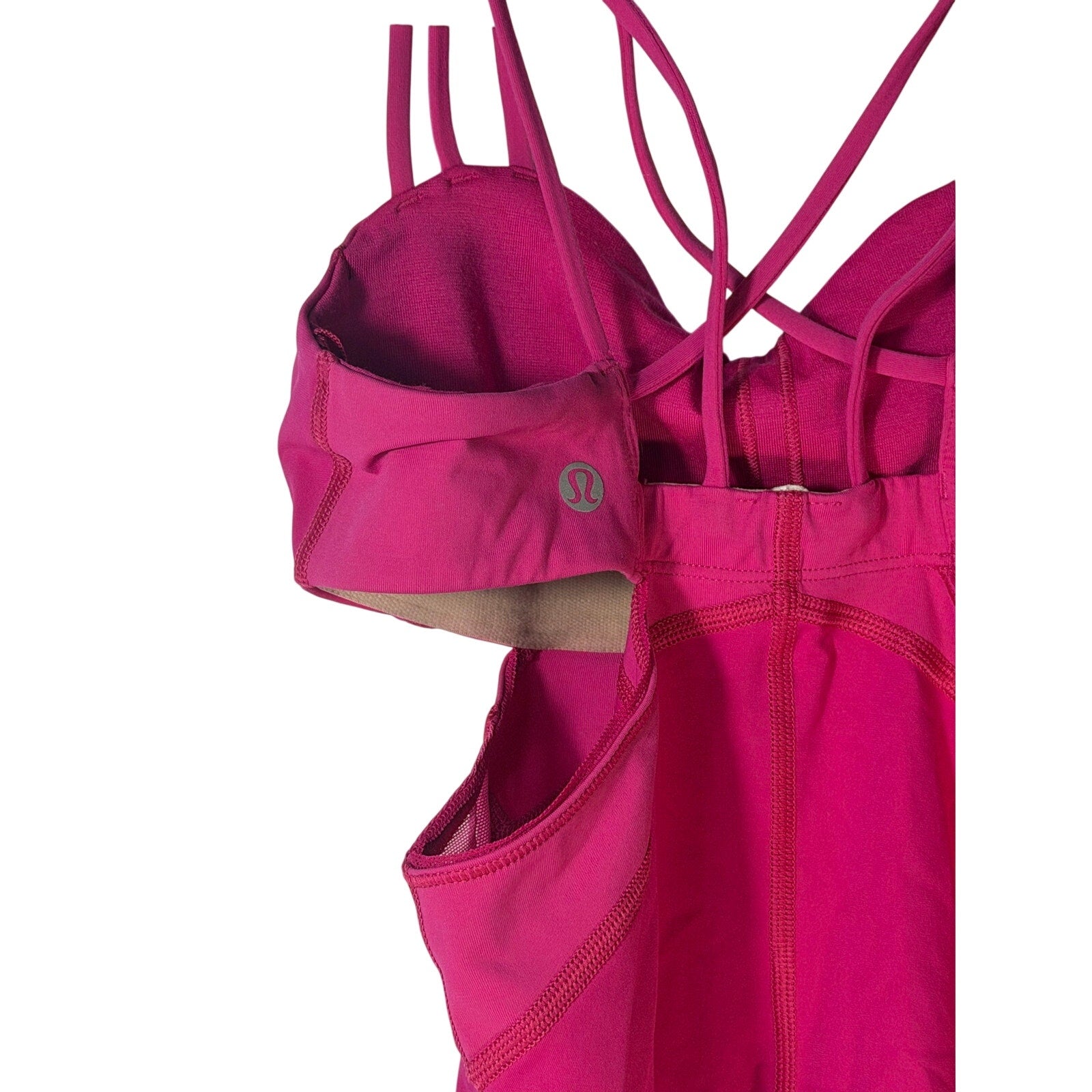 Lululemon women’s magenta strappy cutout athletic tank top, size 2, pre-owned, with stylish design and breathable fabric.
