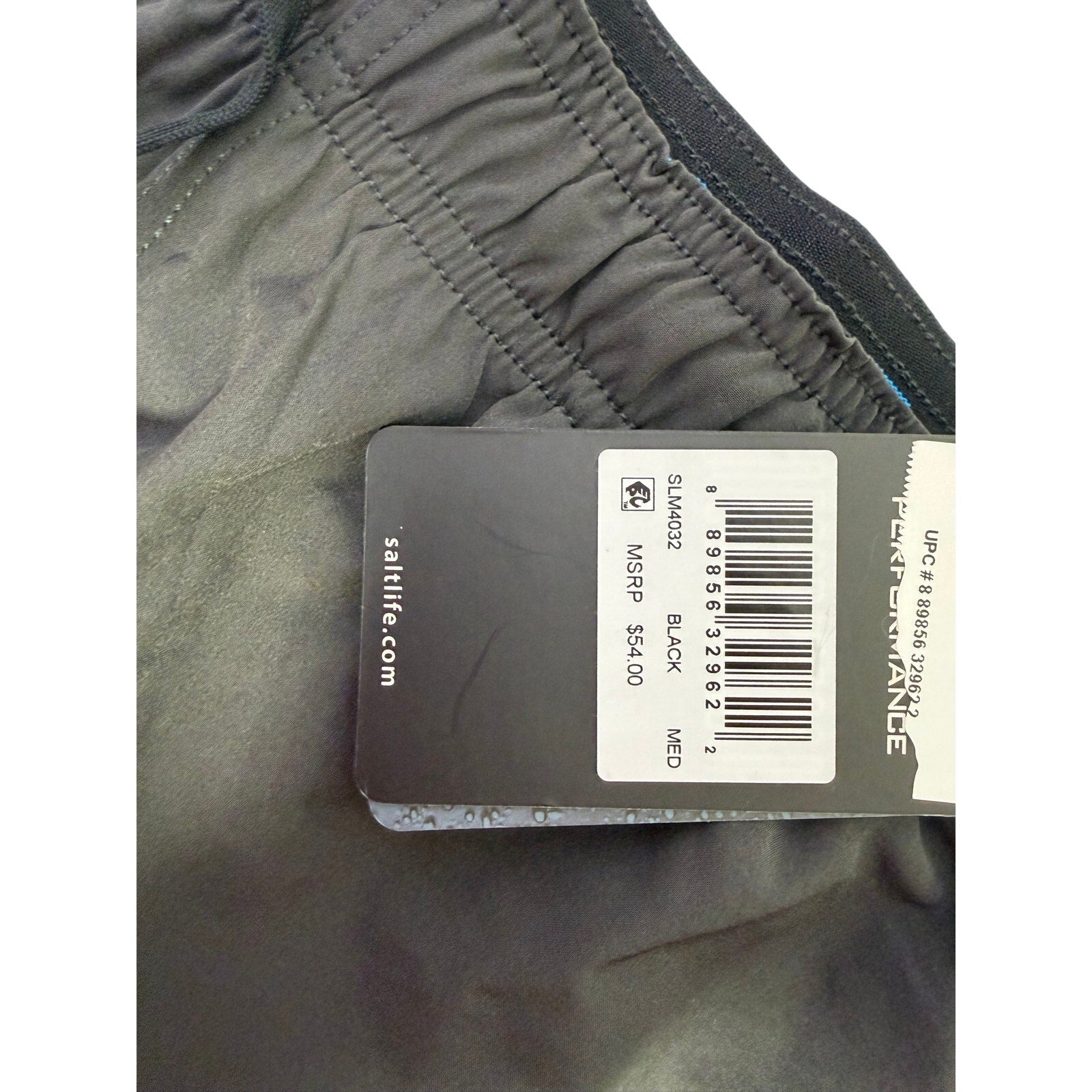 Salt Life men's black Breaker Performance Hybrid Shorts, medium size, showing front view with elastic waistband and shorts fabric.