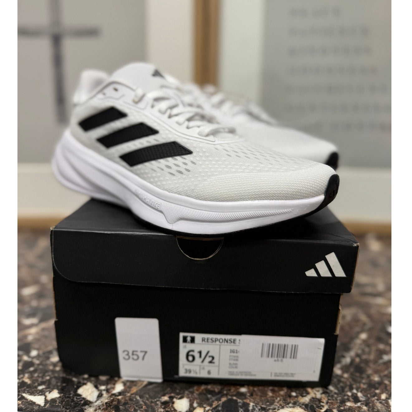 White and black Adidas Response Super running sneakers for women, size 7.5, with silver accents and breathable design